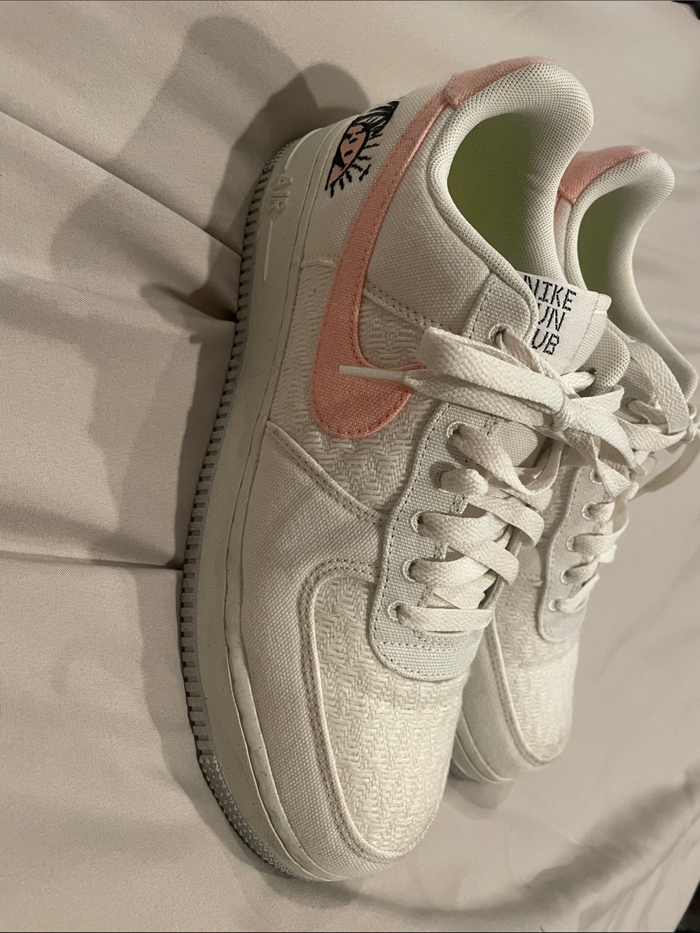 Nike Women’s White Sneakers with Pink Swoosh Accent